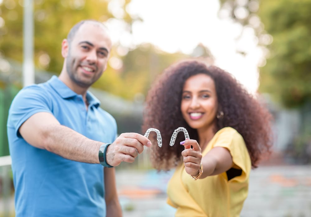 Couple holding an Invisalign in Seattle